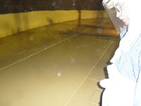 INSPECTING CLEANSINESS BEFORE APPLYING SECOND COAT